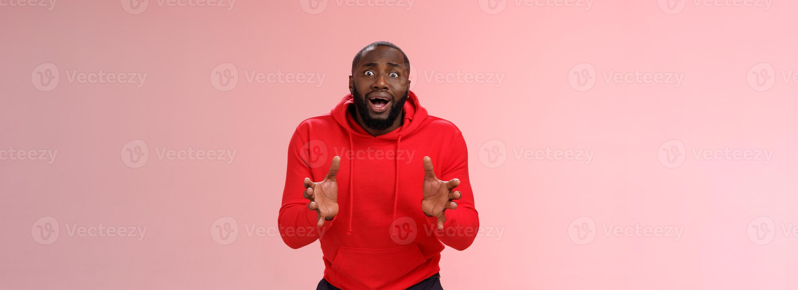 Worried guy asking be careful look how carelessly employee carry fragule things frowning look concerned bending gesturing shocked perplexed standing nervously pink background photo