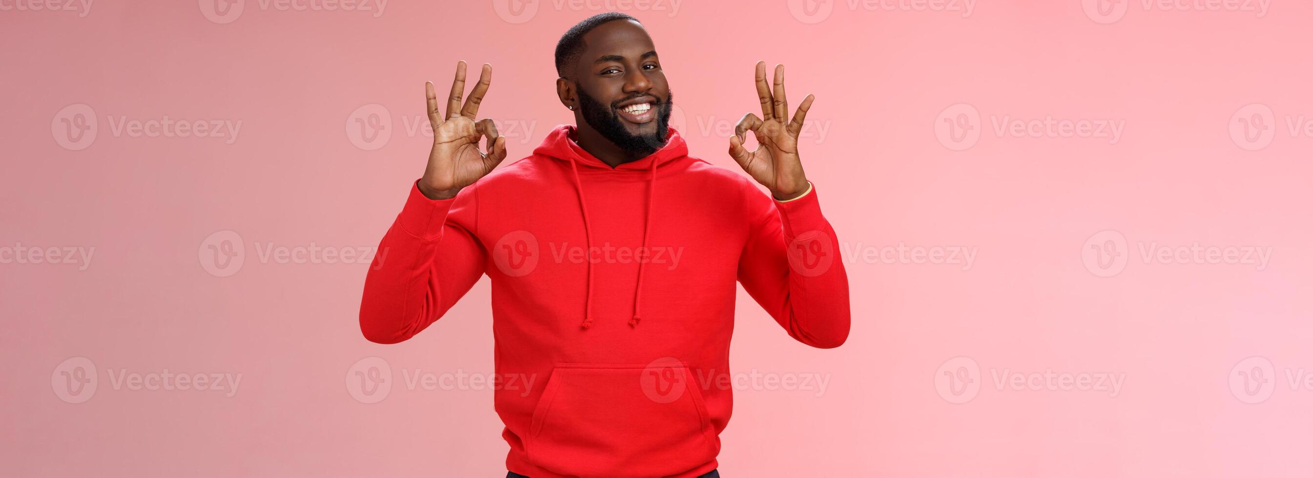 Guy promise perfection. Portrait confident charismatic pleasant african american man show okay no problem gesture say okay smiling assuring everything cool, standing pink background delighted photo