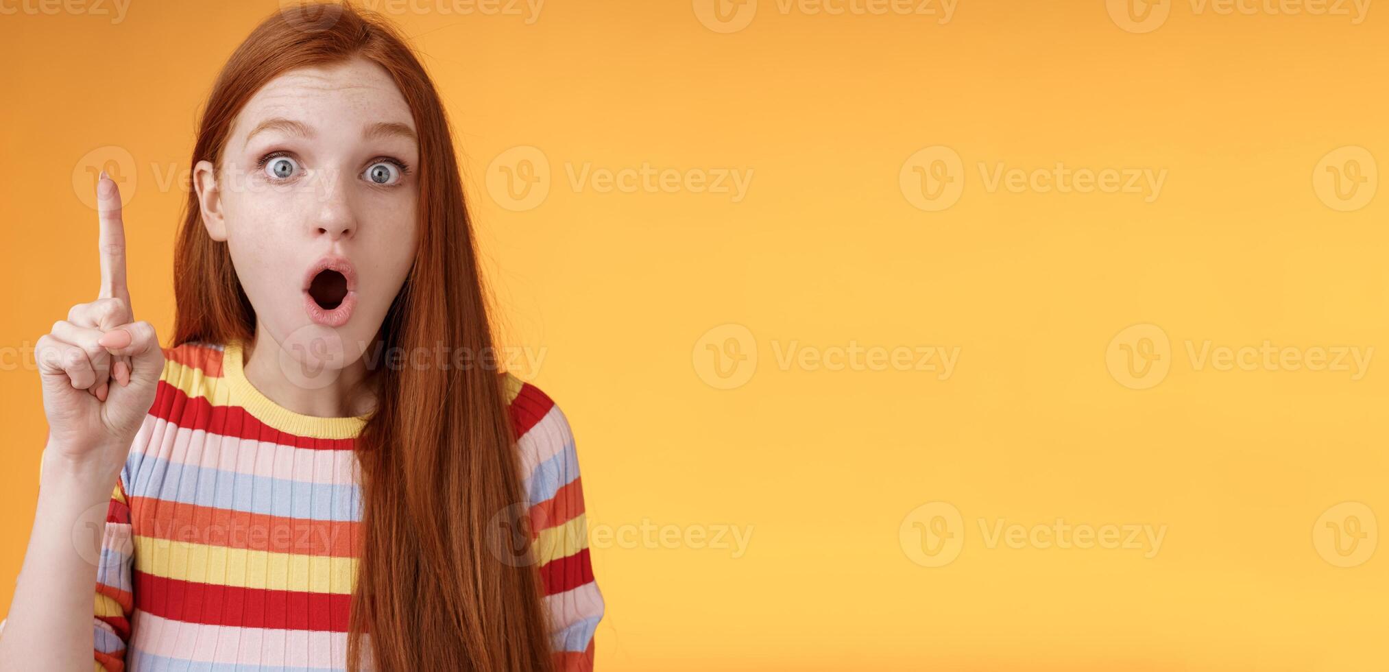 Wow got excellent idea. Excited shocked redhead girl open mouth raise index finger eureka gesture stare camera thrilled adding suggestion have plan think-up solution, standing orange background photo