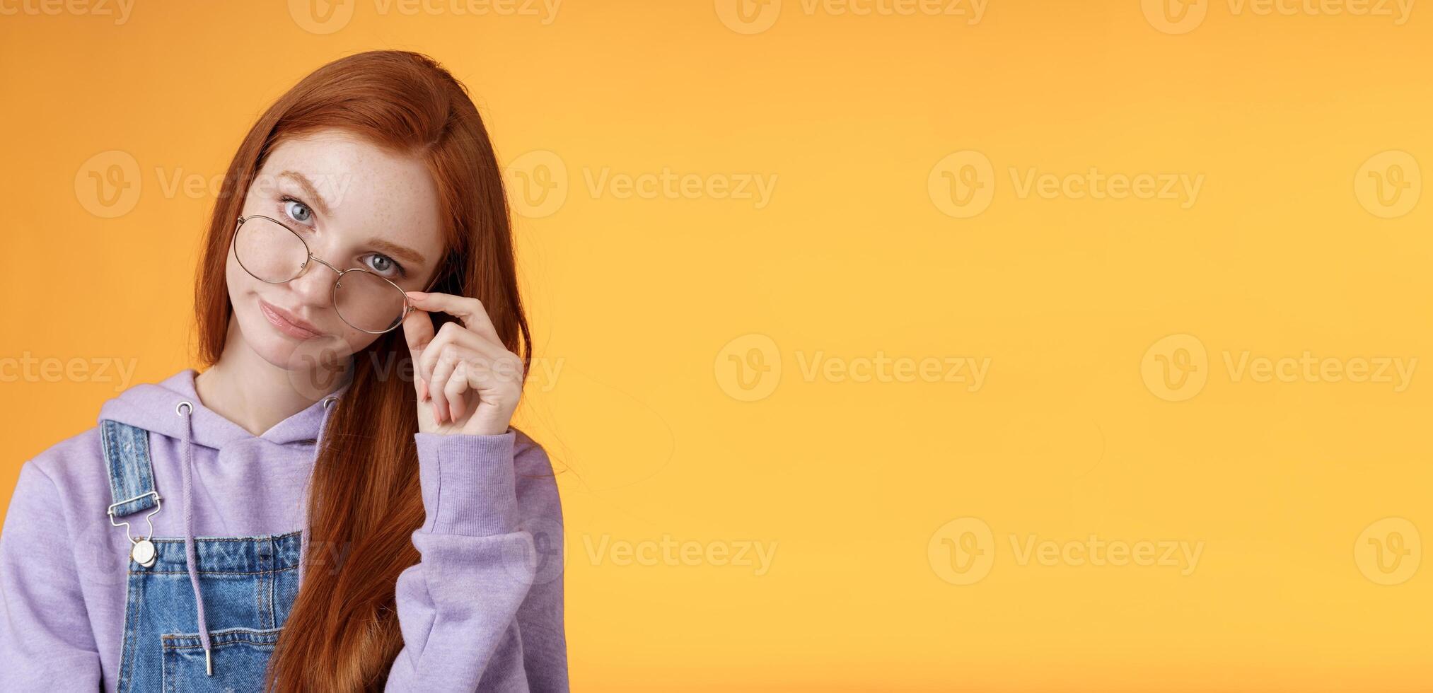 You gotta be kidding me. Annoyed redhead smart irritated elder sister look from under forehead take off glasses roll eyelids smirking disturbed pissed stupid jokes, standing orange background photo