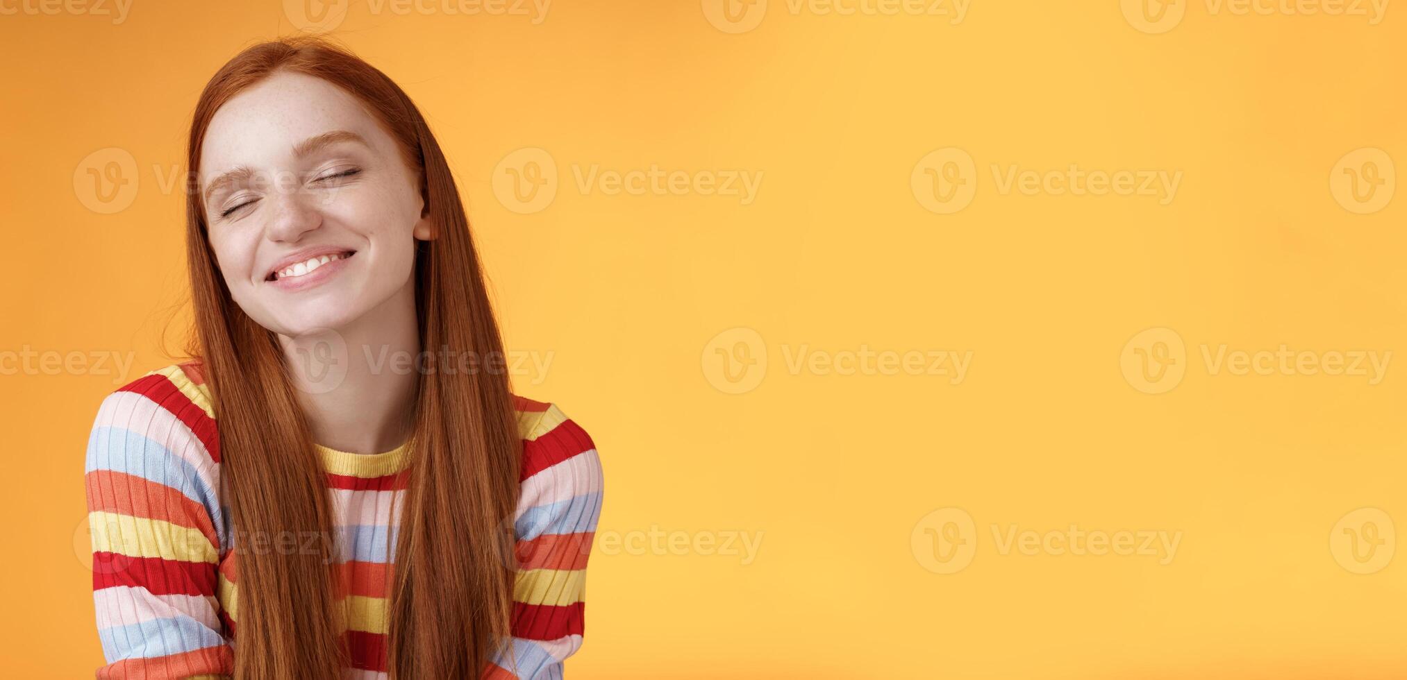 Tender sensual dreamy cute redhead feminine girl dreaming about tasty slice pizza close eyes smiling delighted drooling standing fascinated mesmerized recalling lovely moment, orange background photo