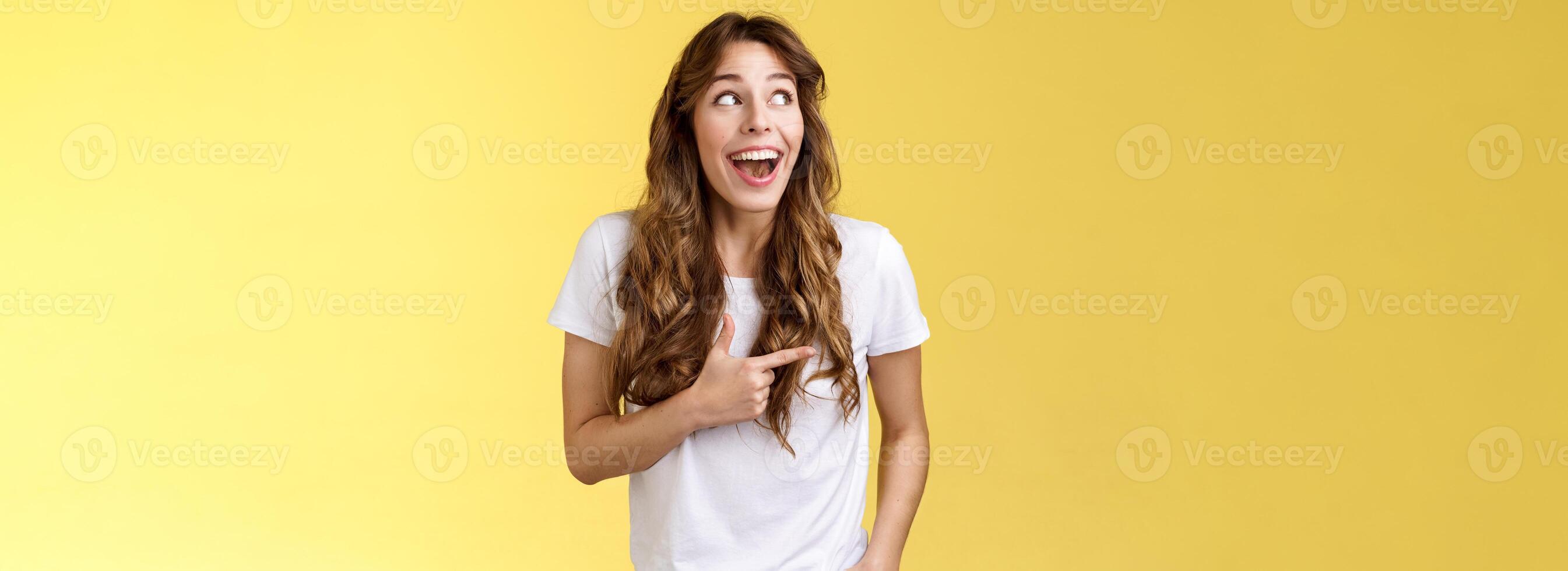 Funny amused cute girlfriend enjoy awesome party having wonderful time spend amazing day city fair open mouth surprised fascinated observe admiration lgbtq pride parade happy yellow background photo