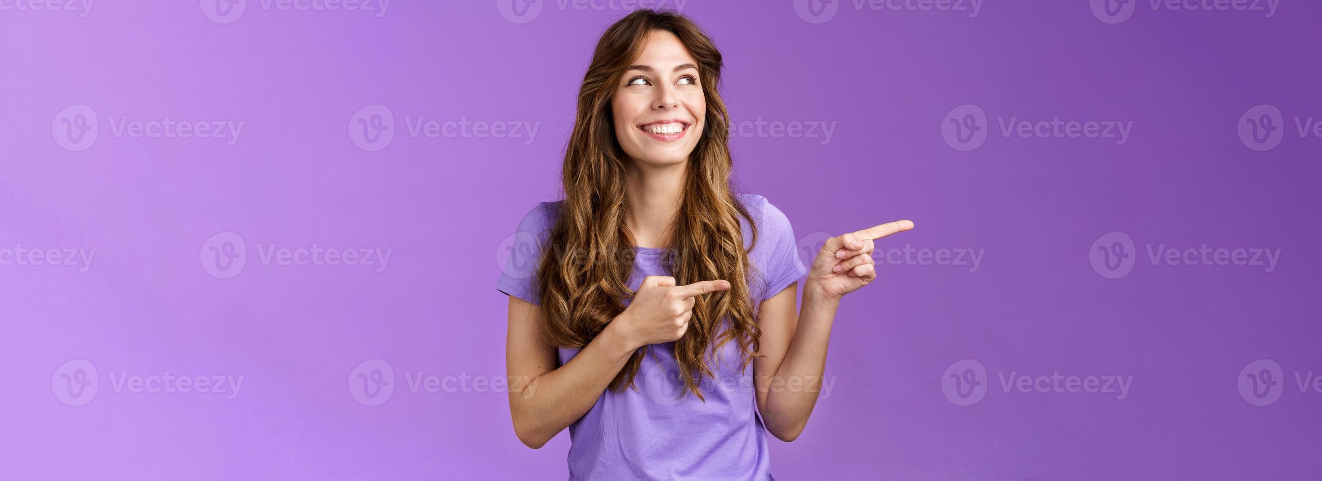 Pretty cheerful smiling happy girl enjoy summer holidays contemplate forein town travel abroad turn pointing left joyfully grinning enjoy shopping making choice showing you good promo photo