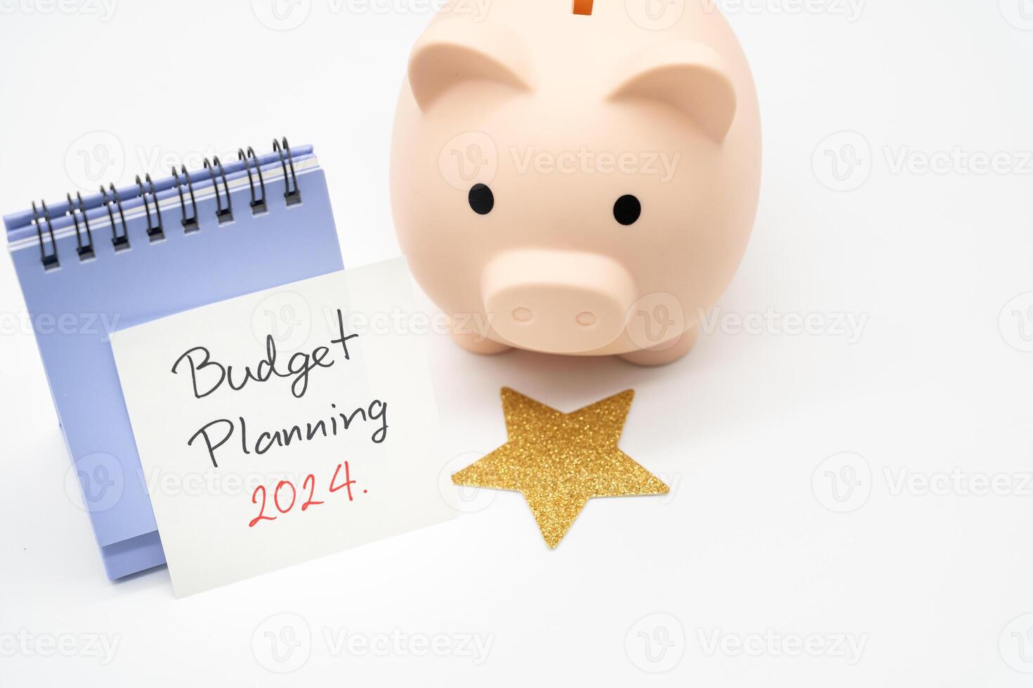 Budget Planning 2024 text message by hand writing on paper note, Calendar, Golden Star and Piggy bank. Budget planning concept. photo