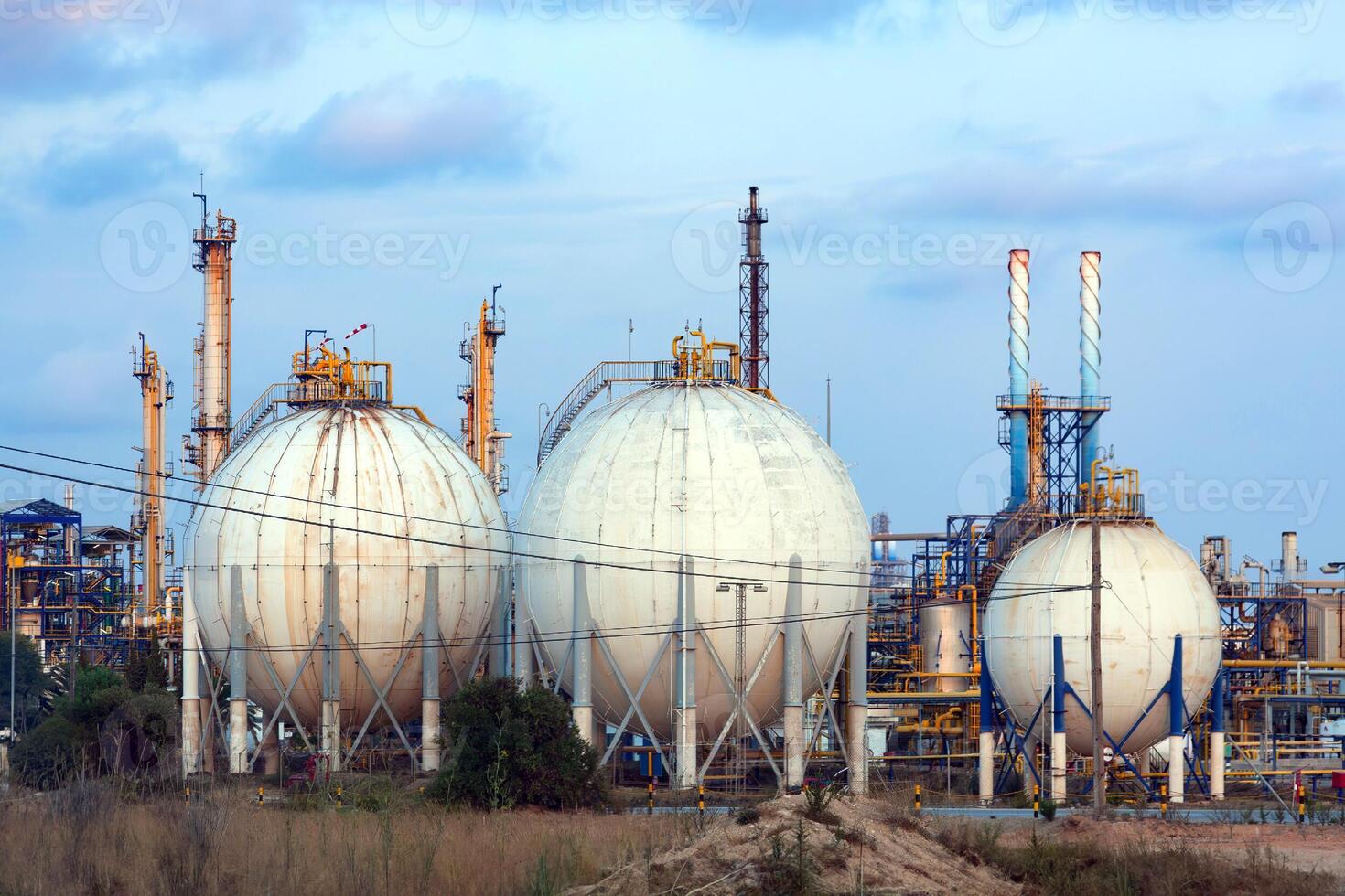 Oil refinery in the evening. Oil industry. Refinery plant. photo