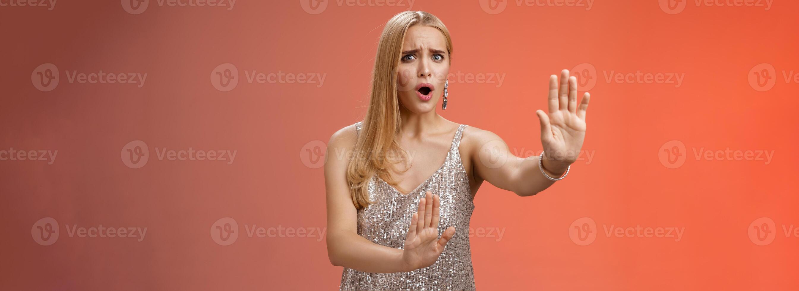No wow slow down. Portrait freak-out displeased woman hear unpleasant suggestion step back extend arms self-defense asking stop enough give rejection refusal look worried, red background photo