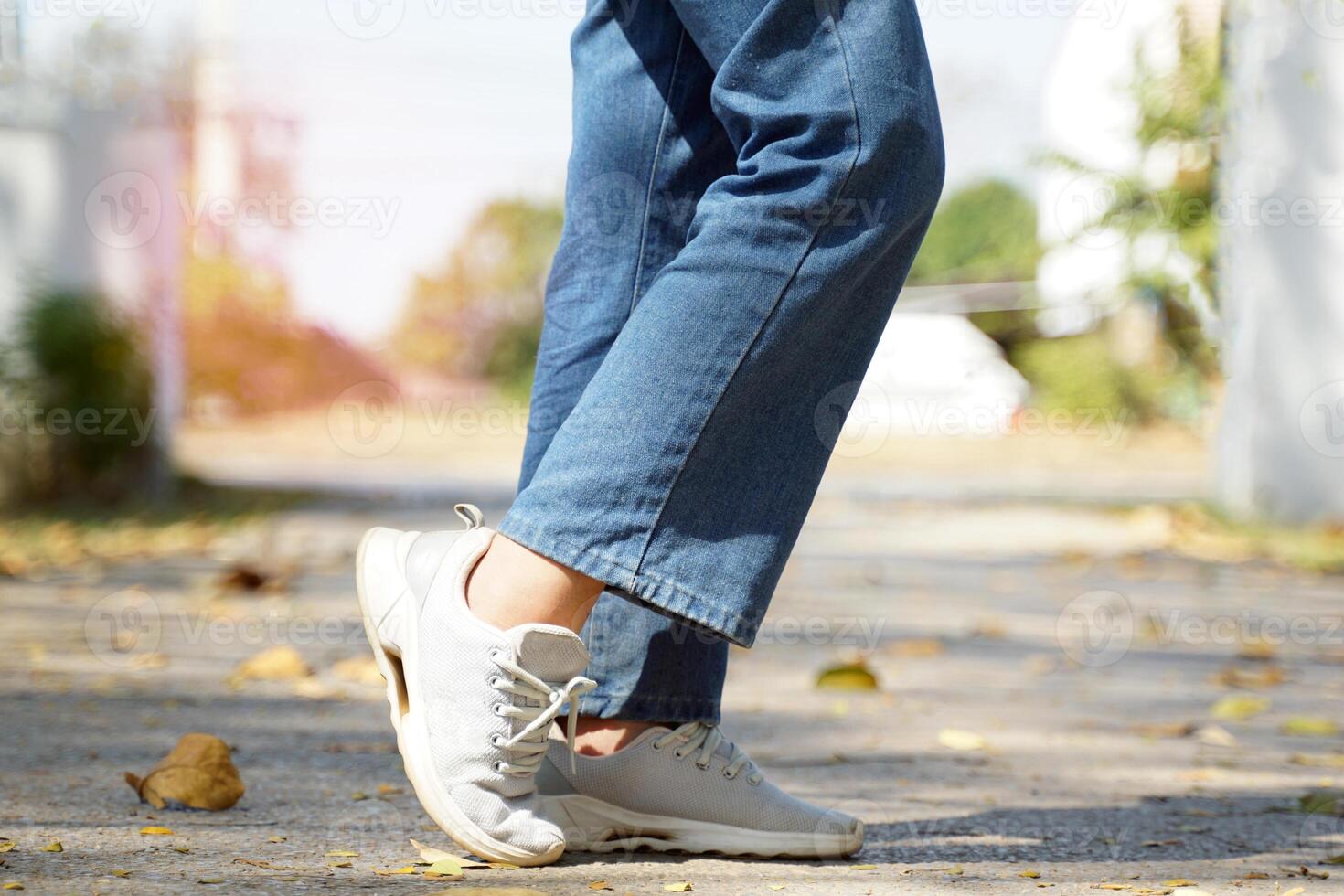 steps of Asian women While walking on the streets of the park, concept steps towards the goal. soft and selective focus. photo