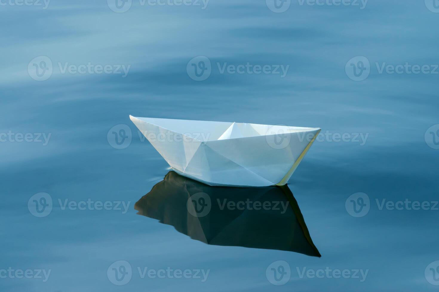 paper boats on the water. photo