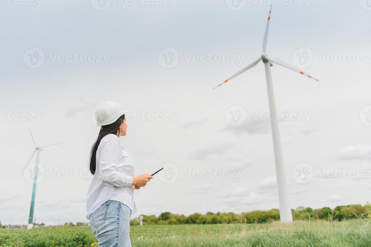 researcher analyzes readouts on wind power station photo
