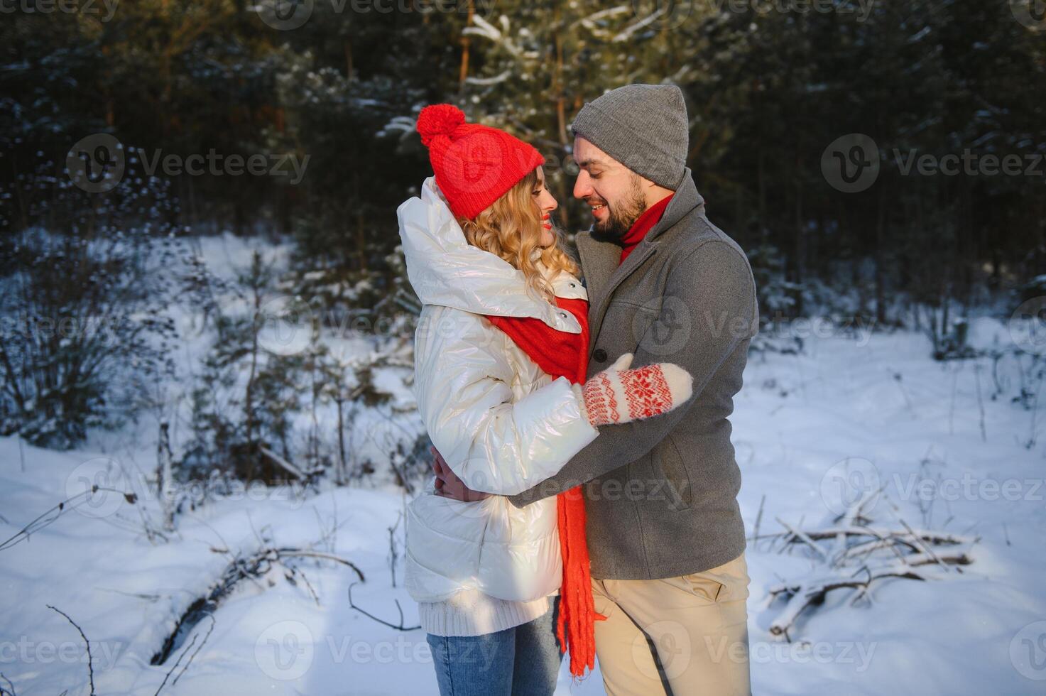 Photo of young attractive couple happy positive smile look each other enjoy time together forest winter love story