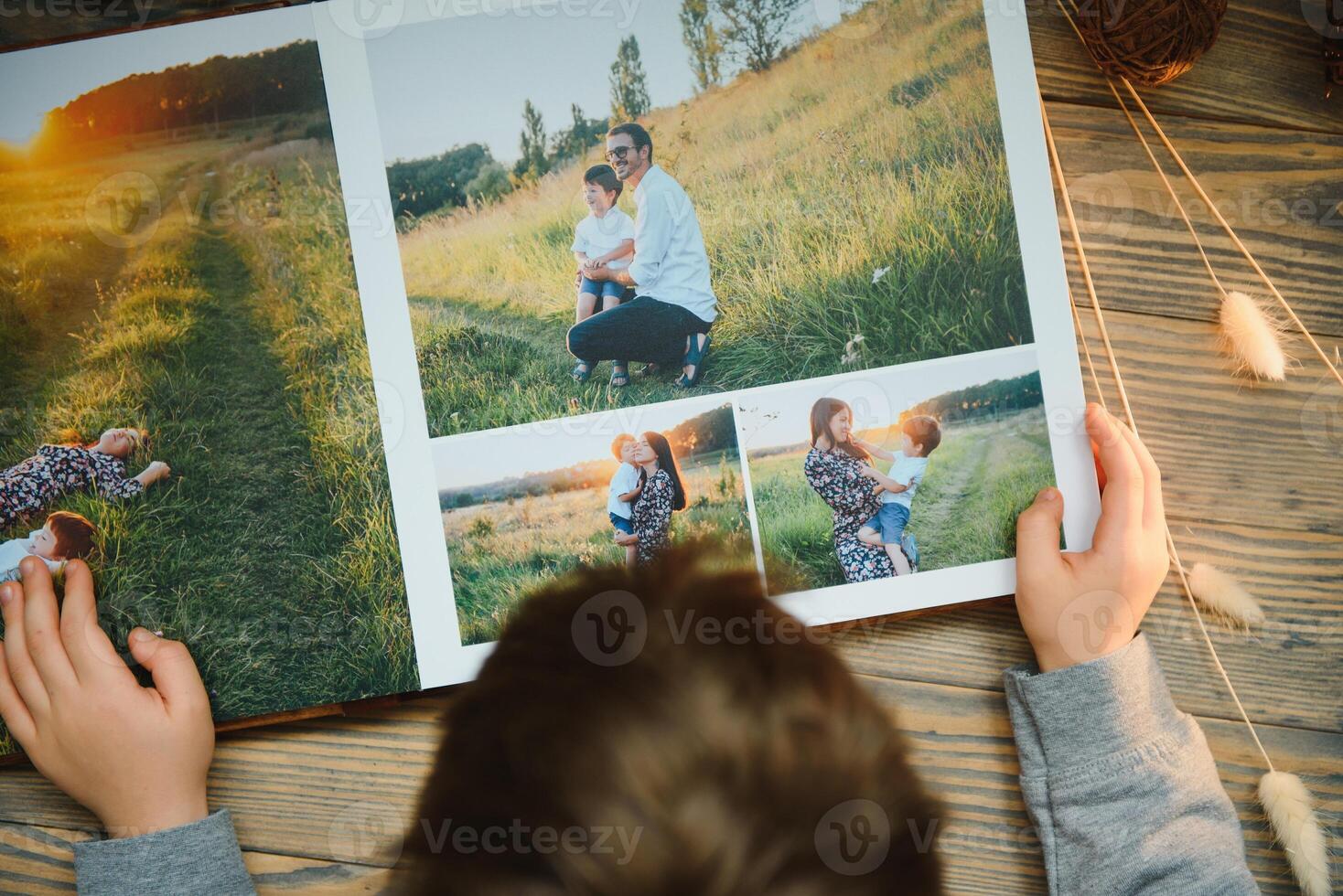 Luxury wooden photo book on natural background. Family memories photobook. Save your summer vacation memories.