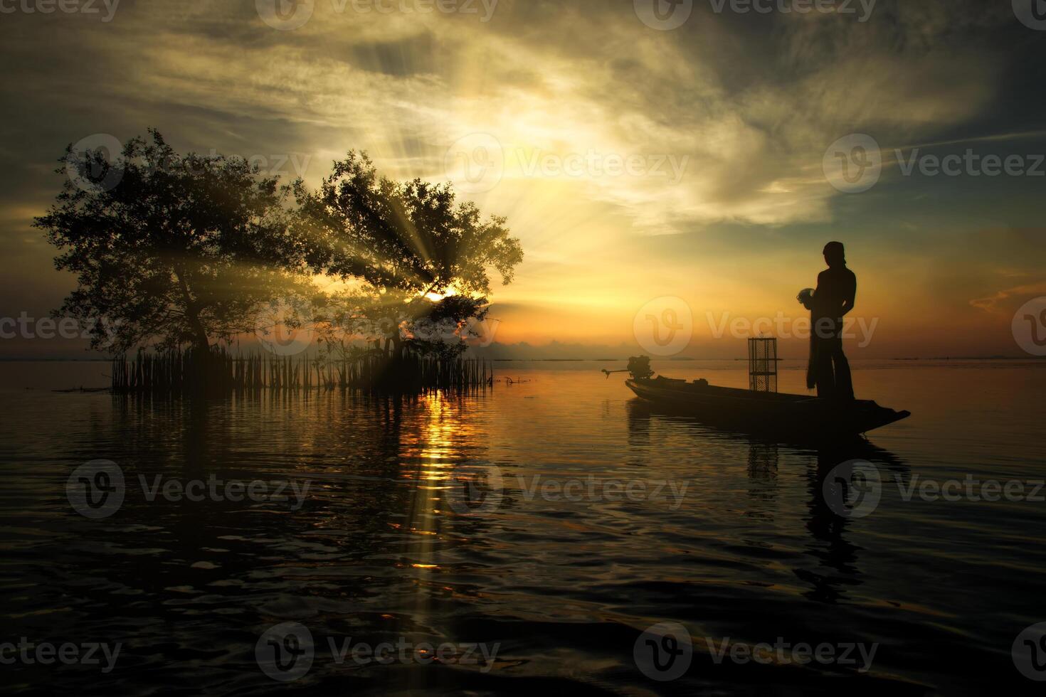 fisherman on the fishing boat photo