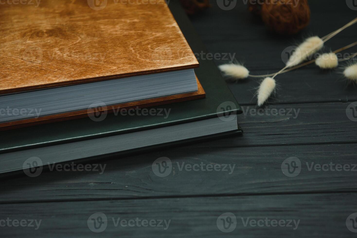 Green wedding or family photo book with leather cover. stylish wedding photo album close up. family photoalbum on wooden background.