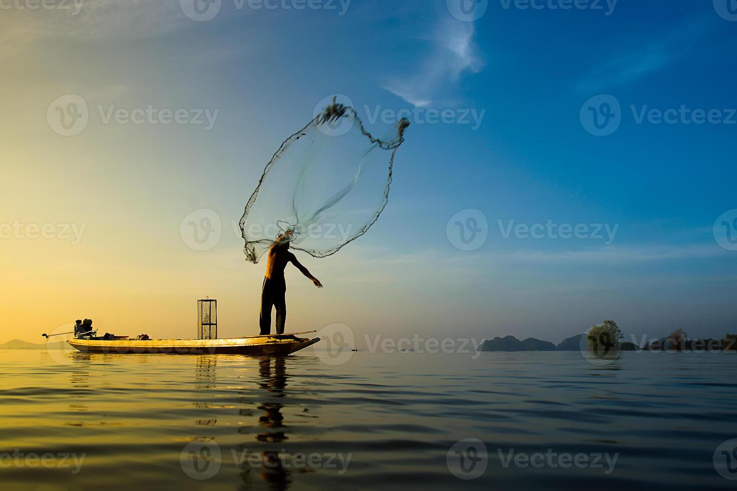 fisherman throwing fishing nets photo