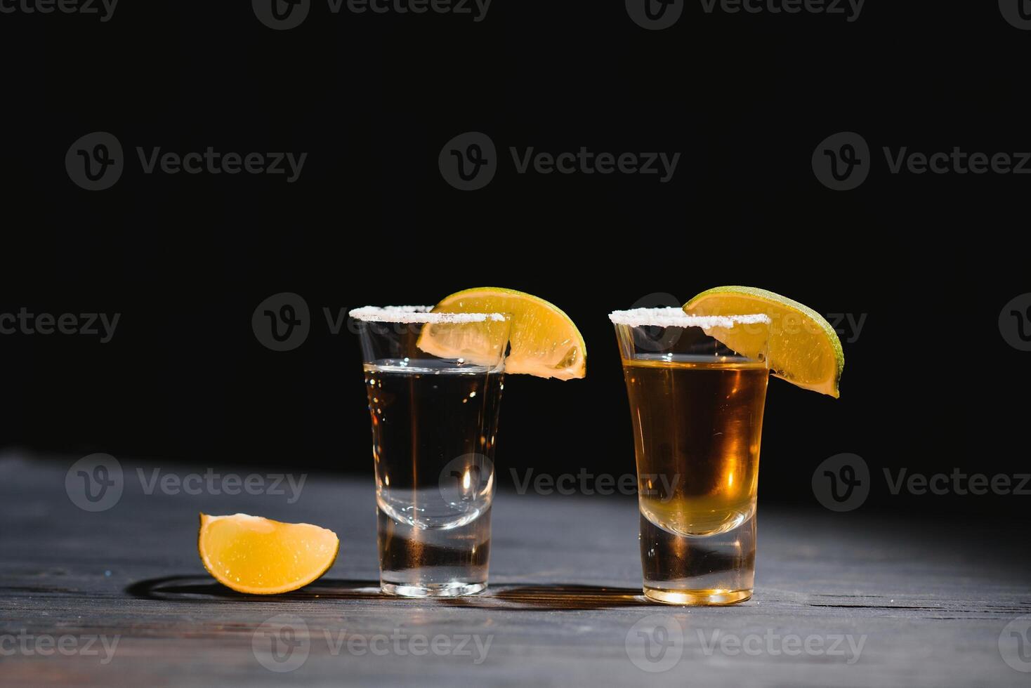 Mexican tequila with lime and salt on rustic wood background. space for text. concept luxury drink. Alcoholic drink concept. photo