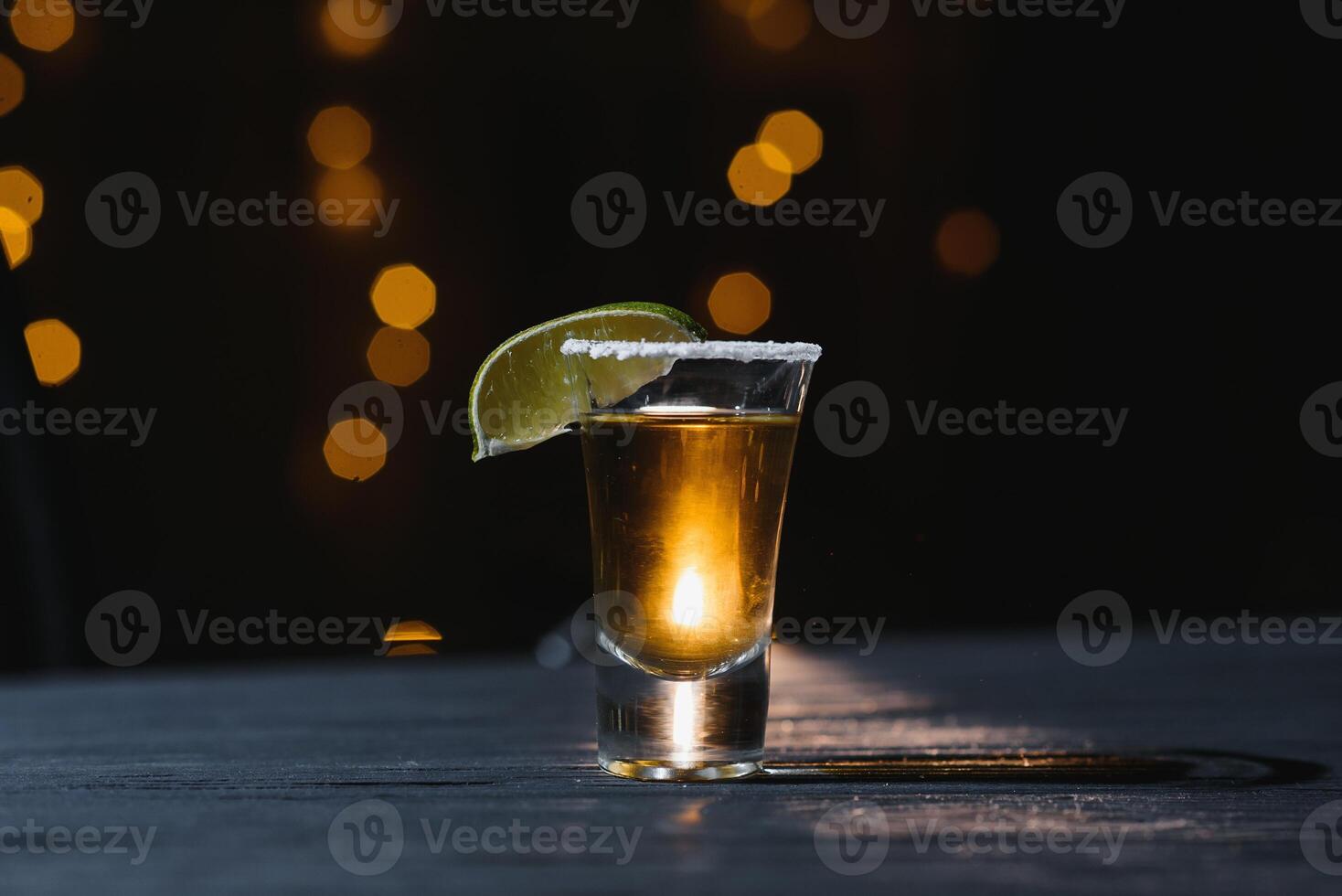 Mexican Tequila with lime and salt on wooden table, selective focus. Copyspace. photo