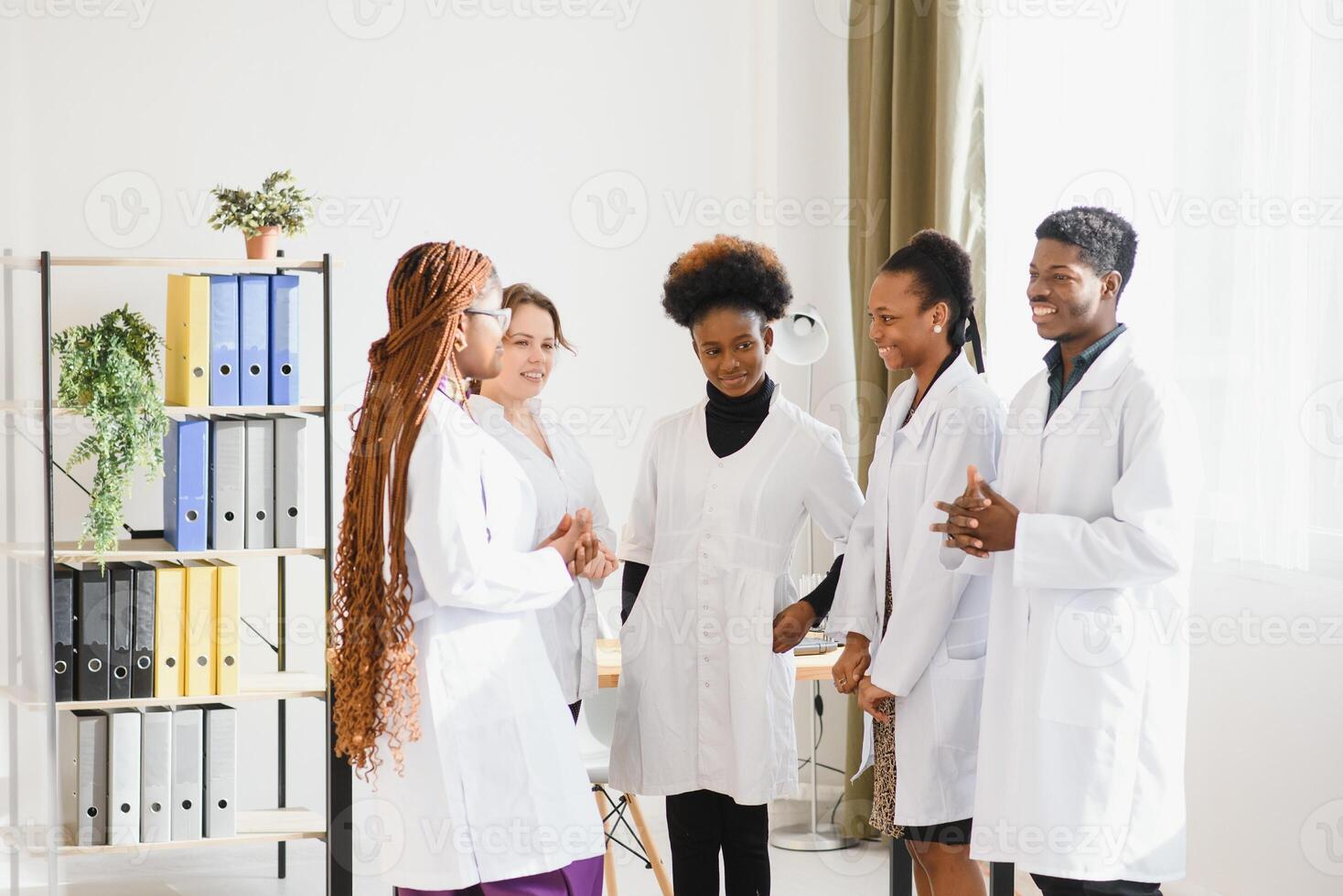 Group of doctors and nurses set in a hospital. photo
