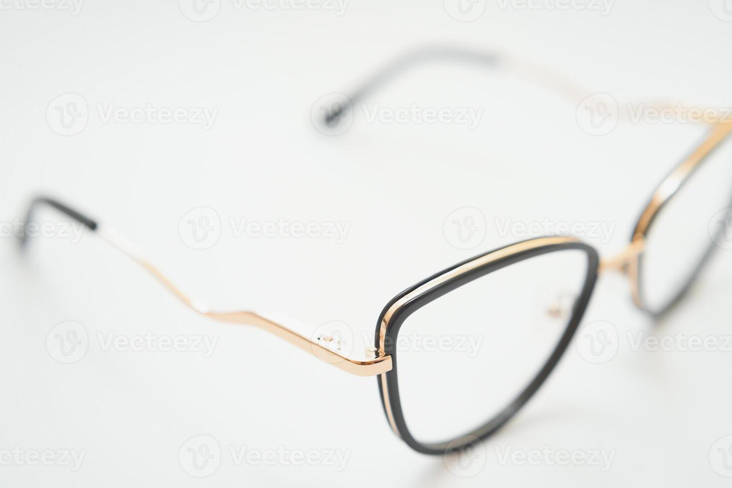 Female eyeglasses macro detail over a white background. Horizontal photo