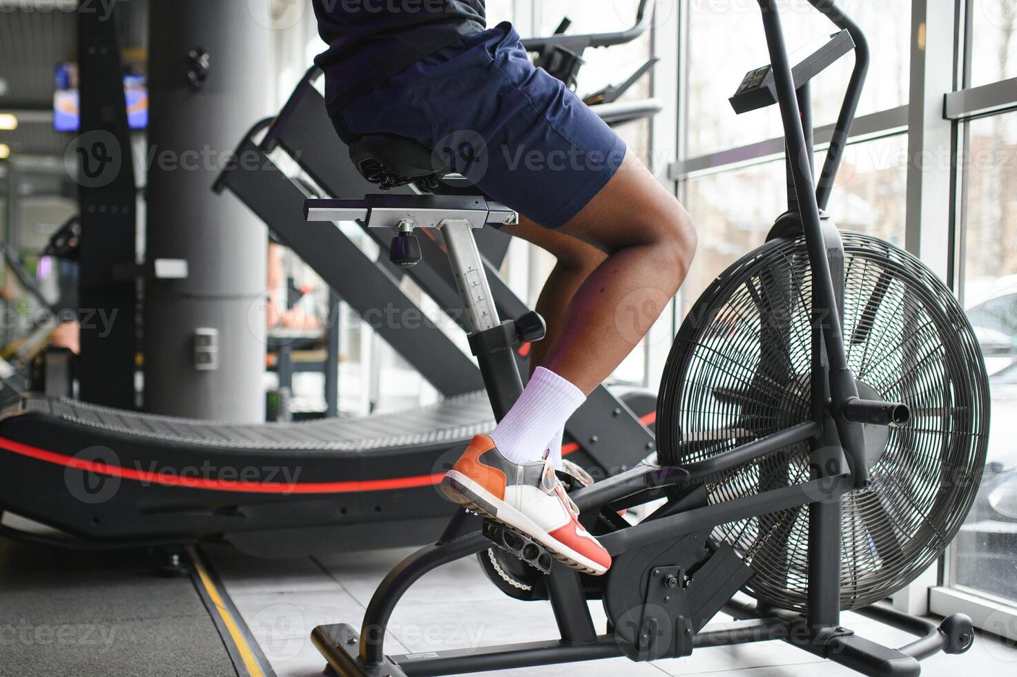 healthy african american man exercising in gym photo