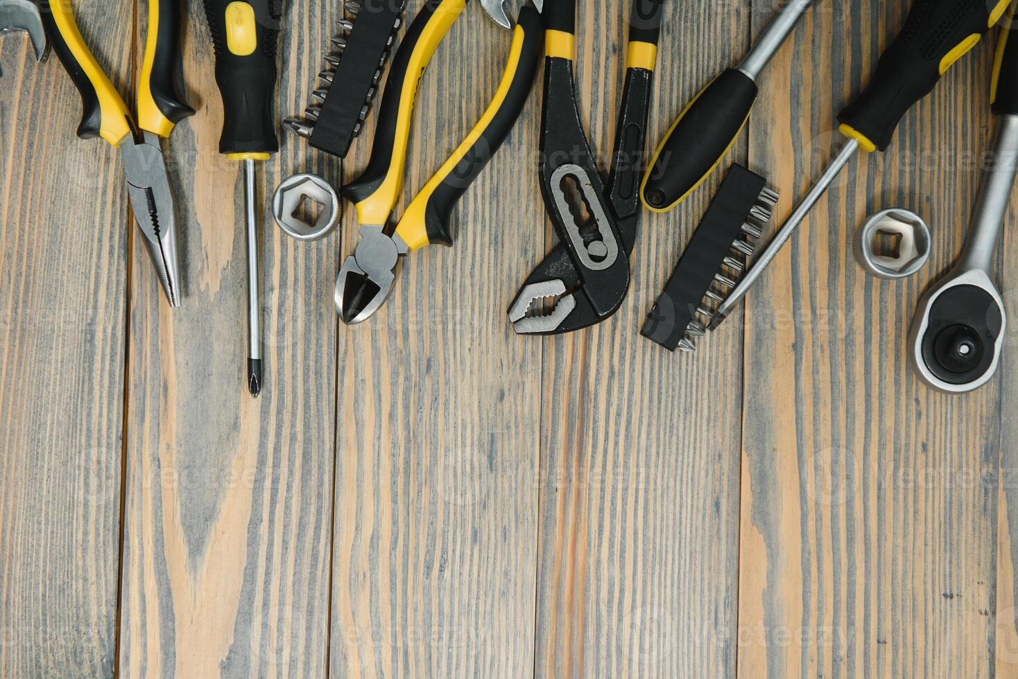 Different tools on a wooden background. photo