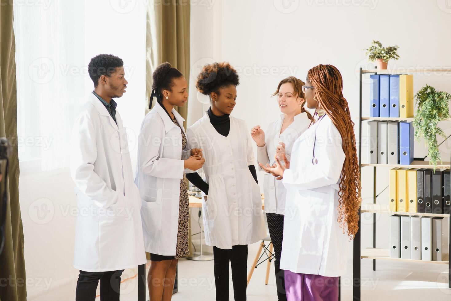 Group of doctors and nurses set in a hospital photo