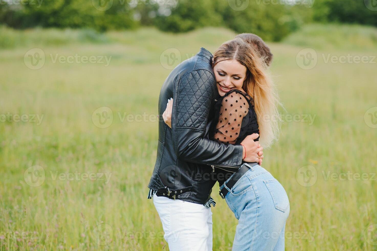 happy couple in love at sunset and smiling photo