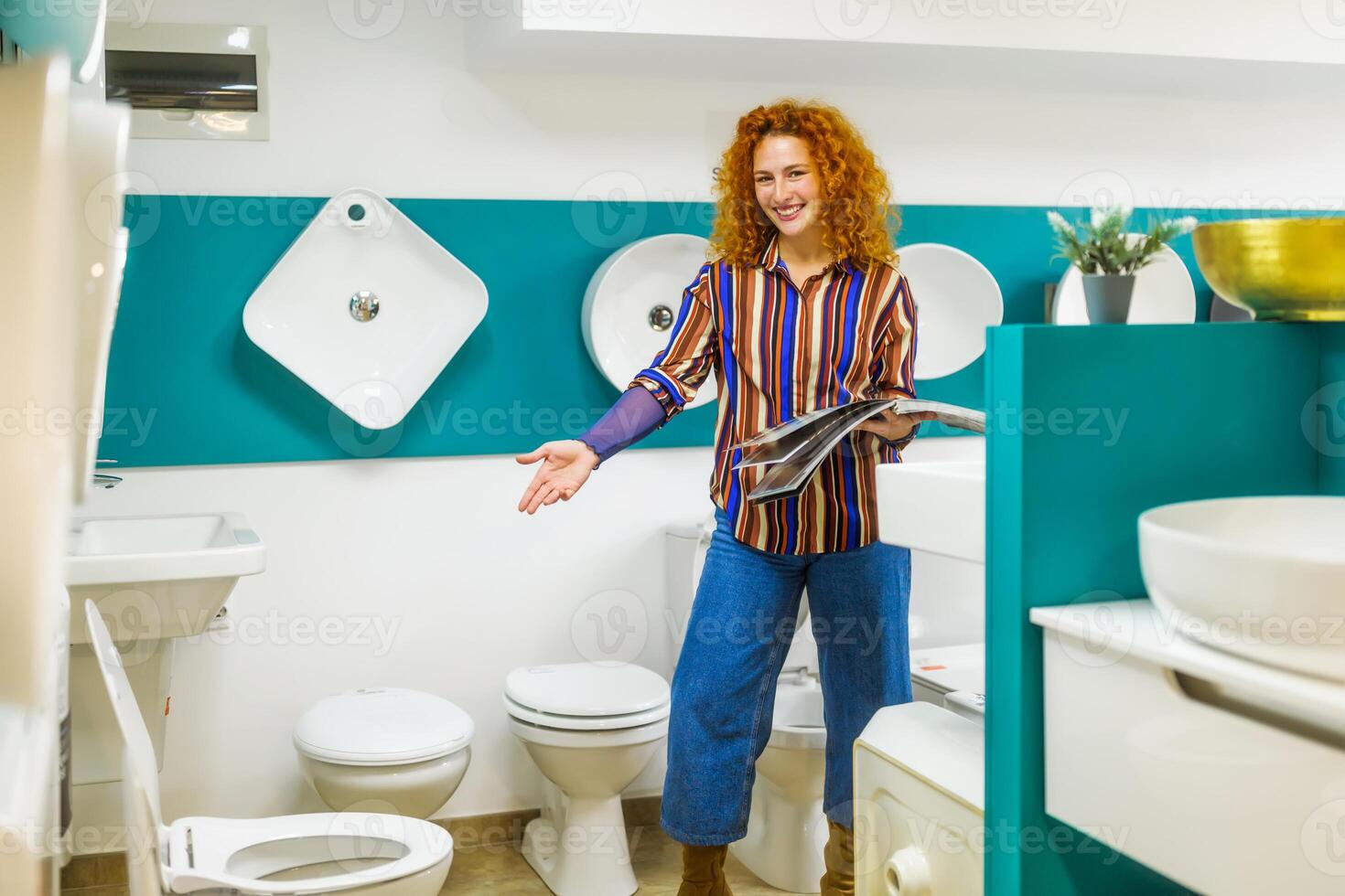 Portrait of salesperson in bathroom store. Happy redhead woman works in bath store. Sales occupation. photo