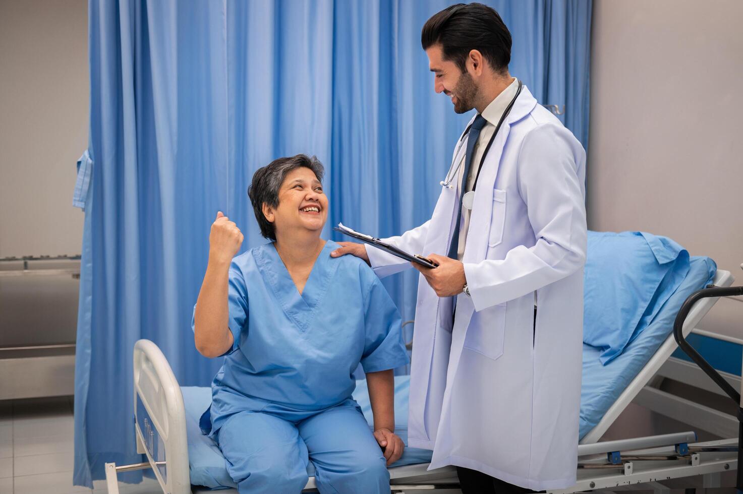 doctor consulting senior old patient filling form consultation in hospital photo