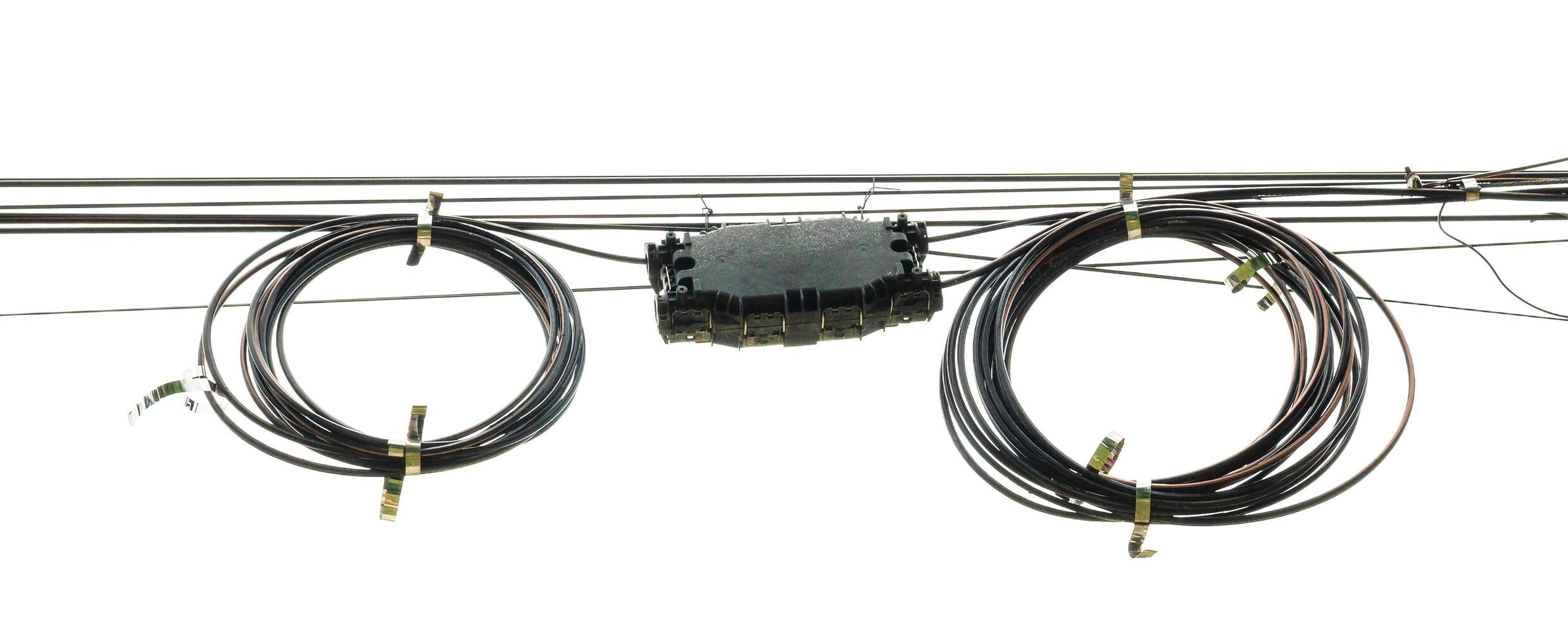 electric black wire cable curled shaped isolate on white background photo