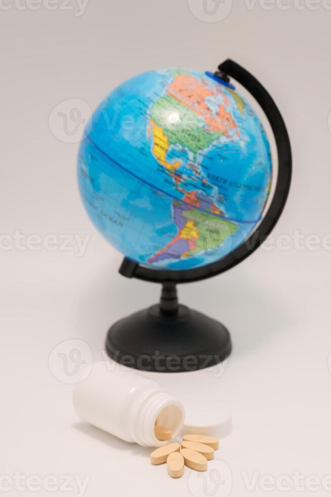 Medicine on hand and global white background photo