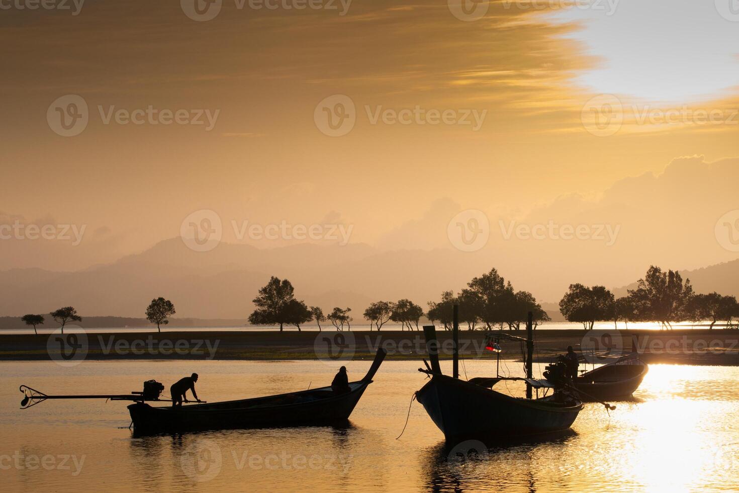 Long tail boat on tropical beach, under cloudy sky photo