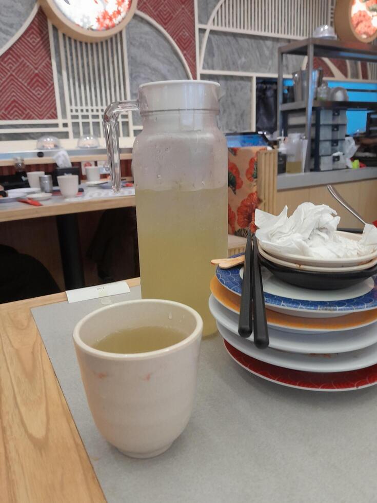 Palembang, Indonesia - December 18, 2023 Photo of piles of dirty dinner plates in a restaurant