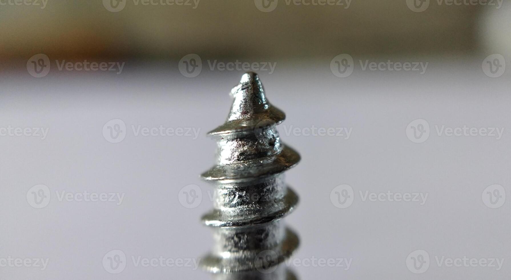 Screws on a white background. Close-up. Macro photo