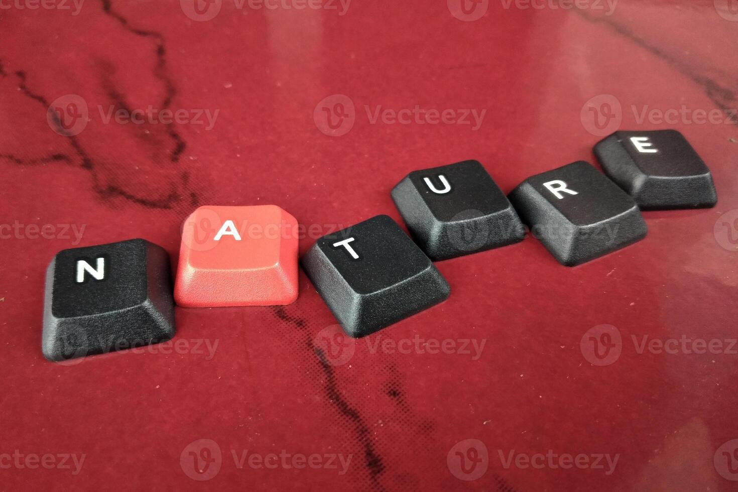 keyboard keys with the word autumn in black letters on red background photo