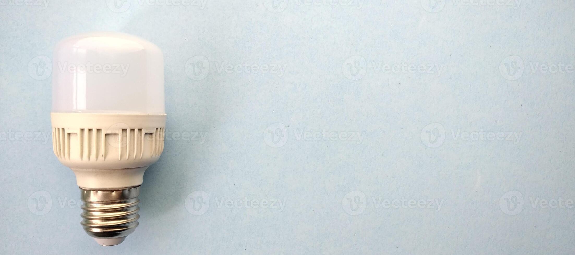 LED light bulb on a blue background. The concept of saving energy photo