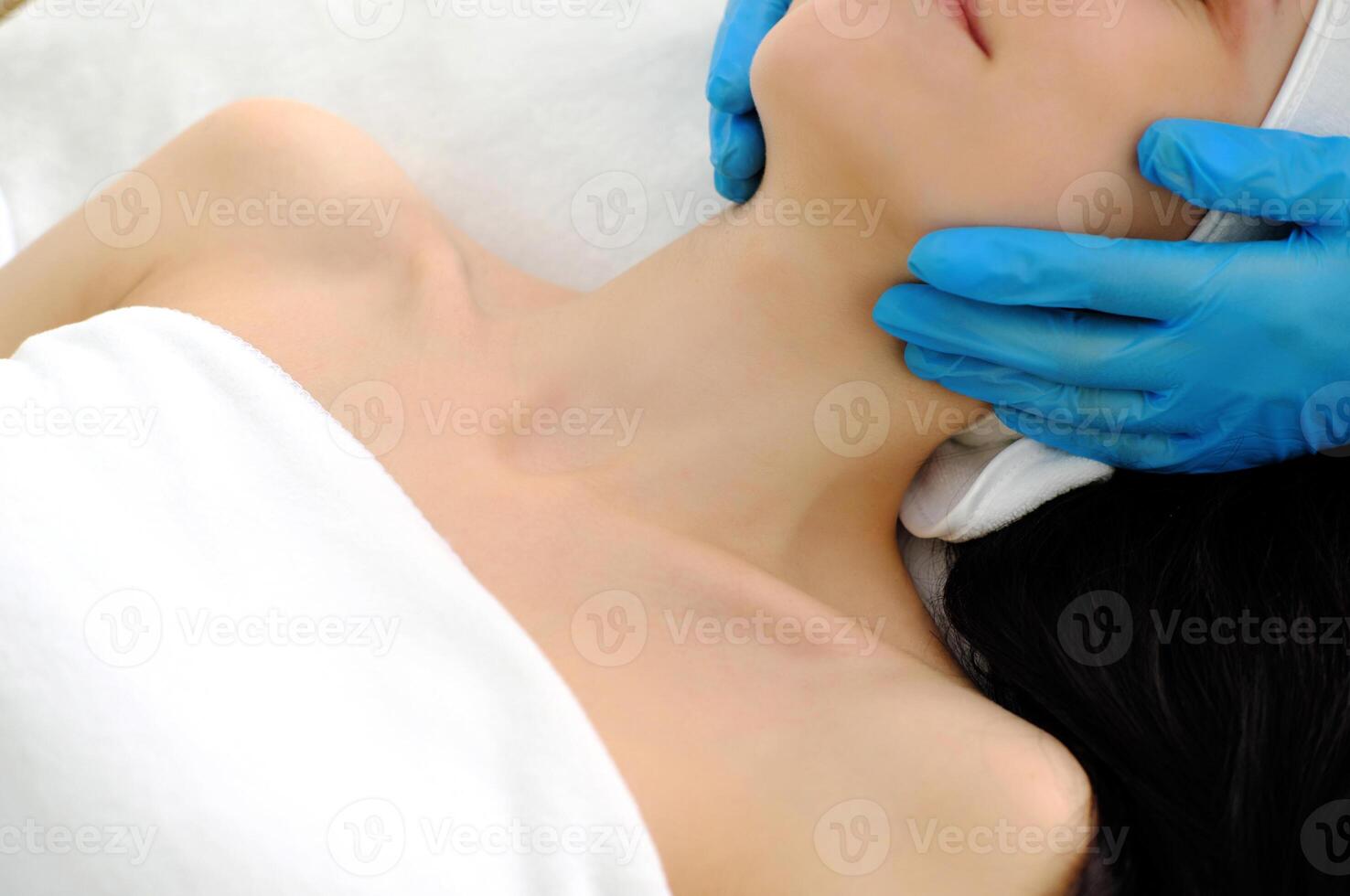 Professional Cosmetologist Treating Client's Neck photo