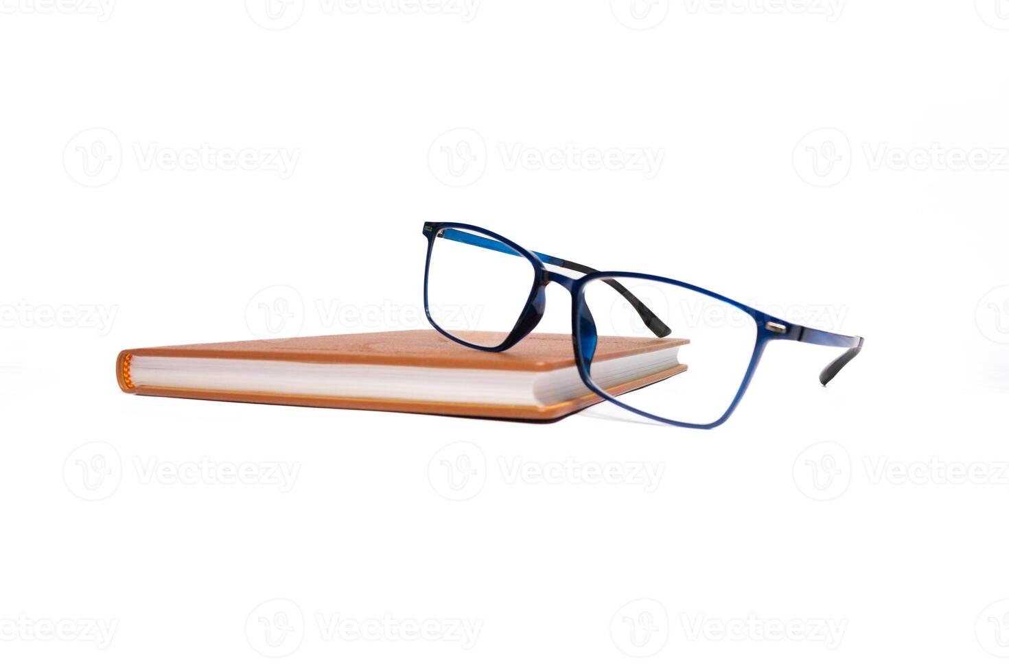 Book and sunglasses isolated on white background. After some edits. photo