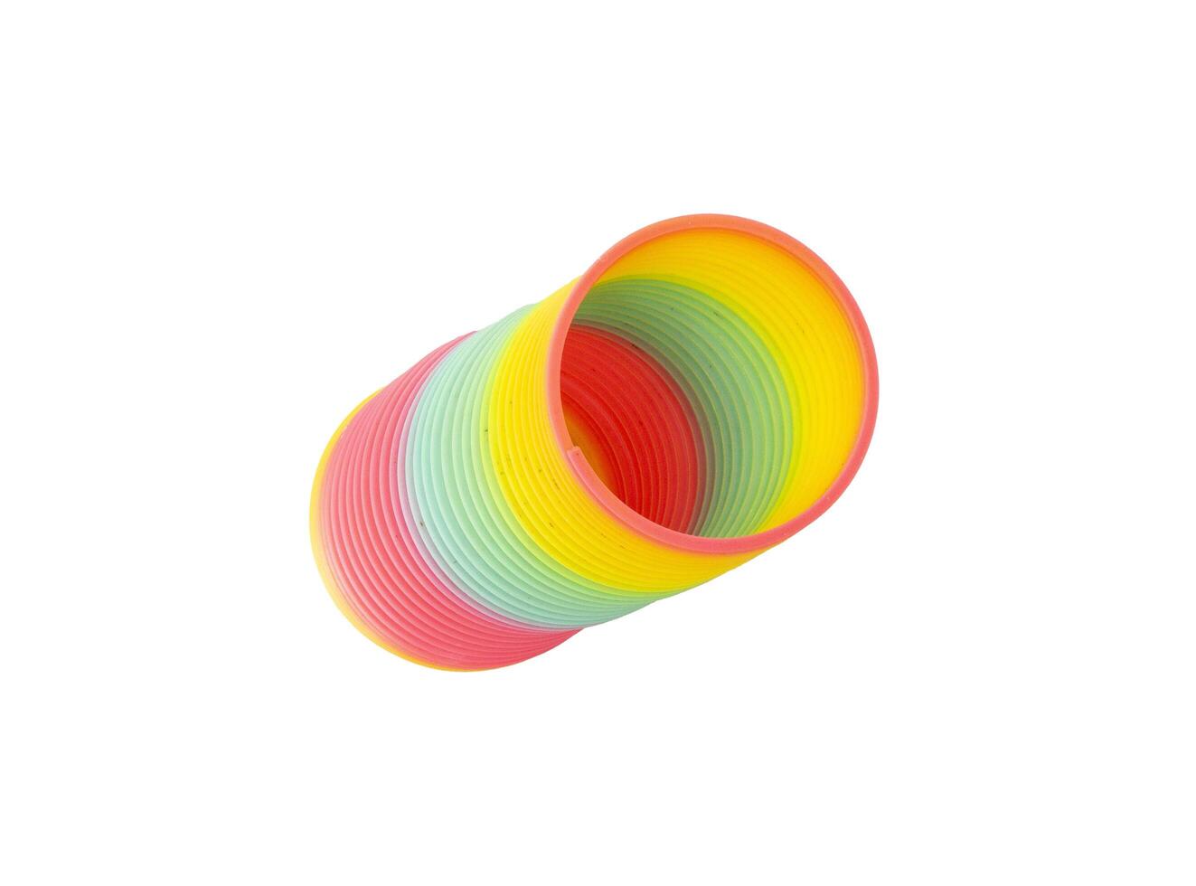 Rainbow for kid toy on isolated background, A rainbow color toy, A Rainbow colored wire spiral toy on white background photo