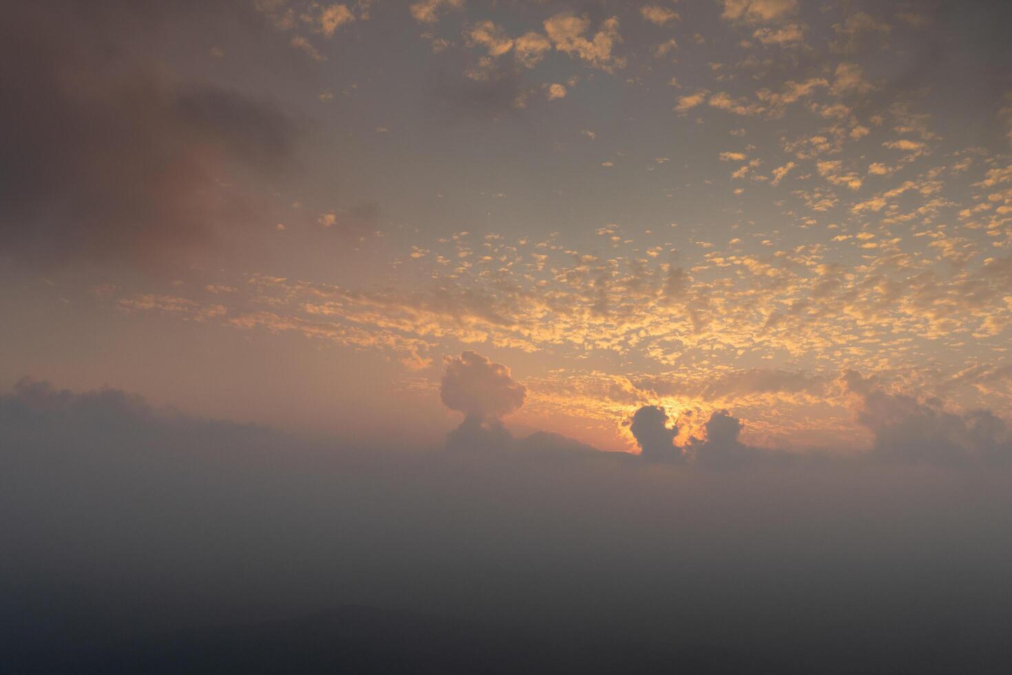 Abstract background of sunset sky with cloud. Amazing golden light in the evening. For background and textured. photo