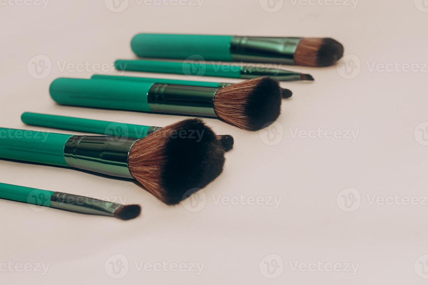 Green bones for make-up on a light background. photo