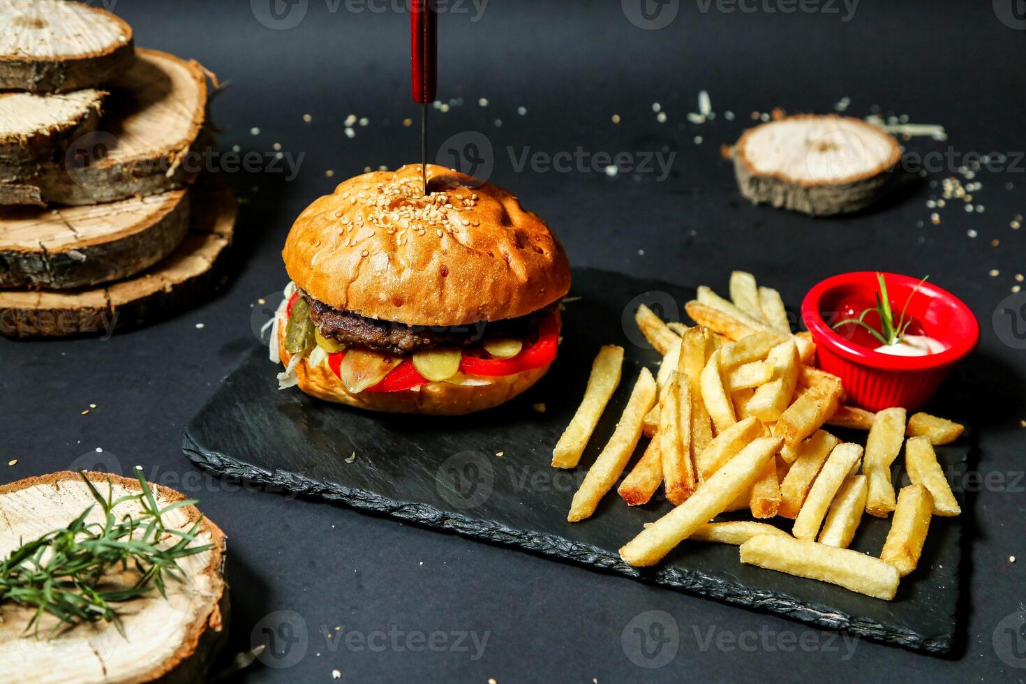 Hamburger and French Fries on Black Plate photo
