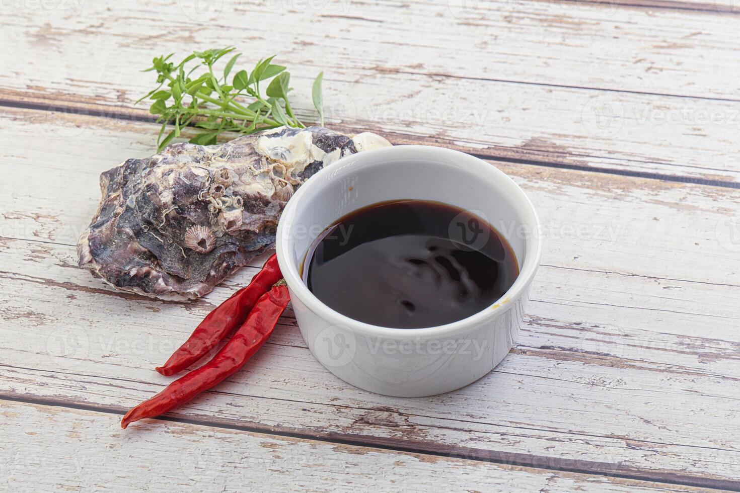 Chinese cuisine - oyster sauce served shell photo