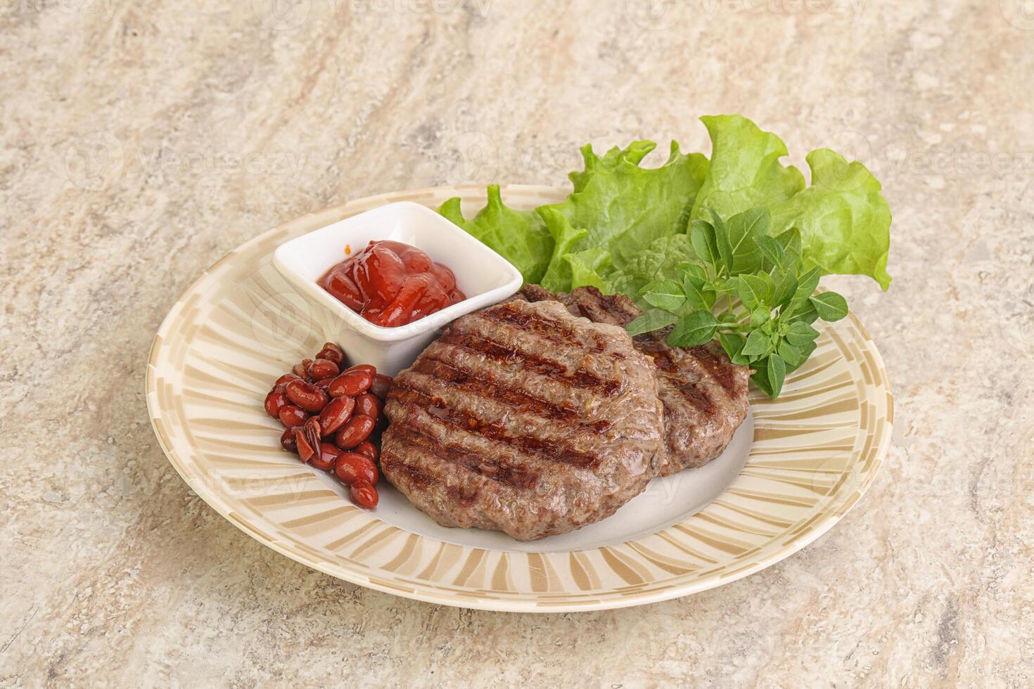 Grilled beef burger cutlet with sauce photo