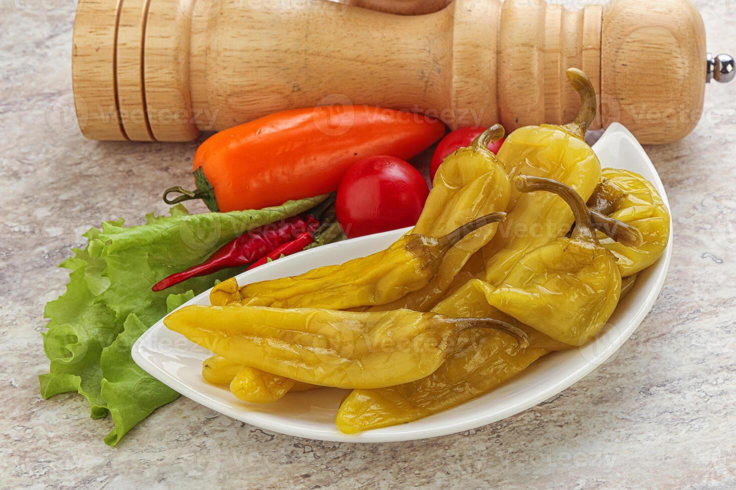Pickled marinated spicy green pepper photo