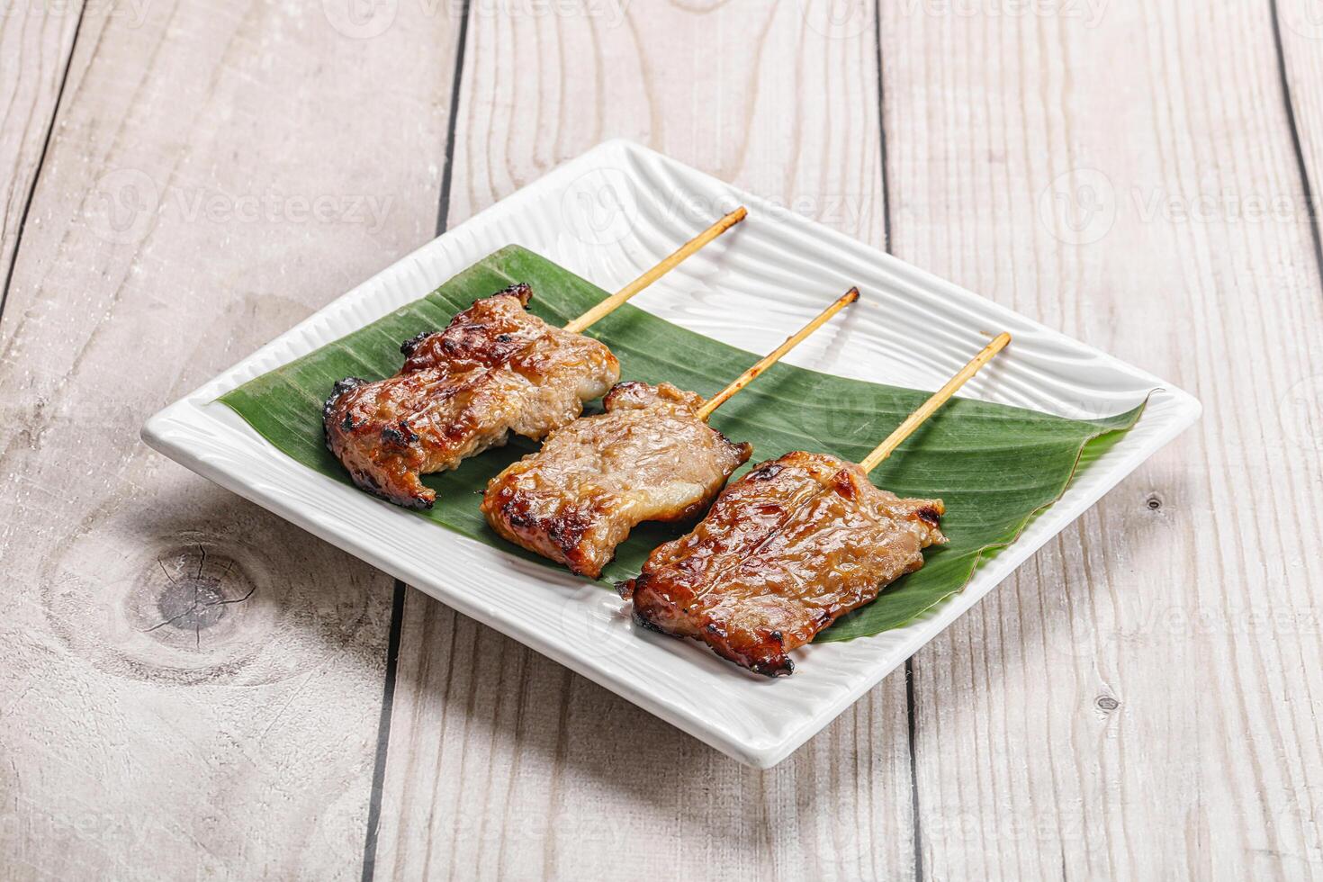 Thai cuisine - grilled pork skewer photo