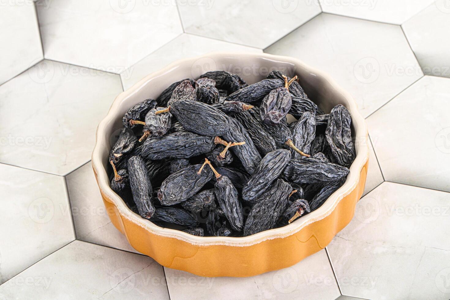 Blue raisin - dry grape berries photo