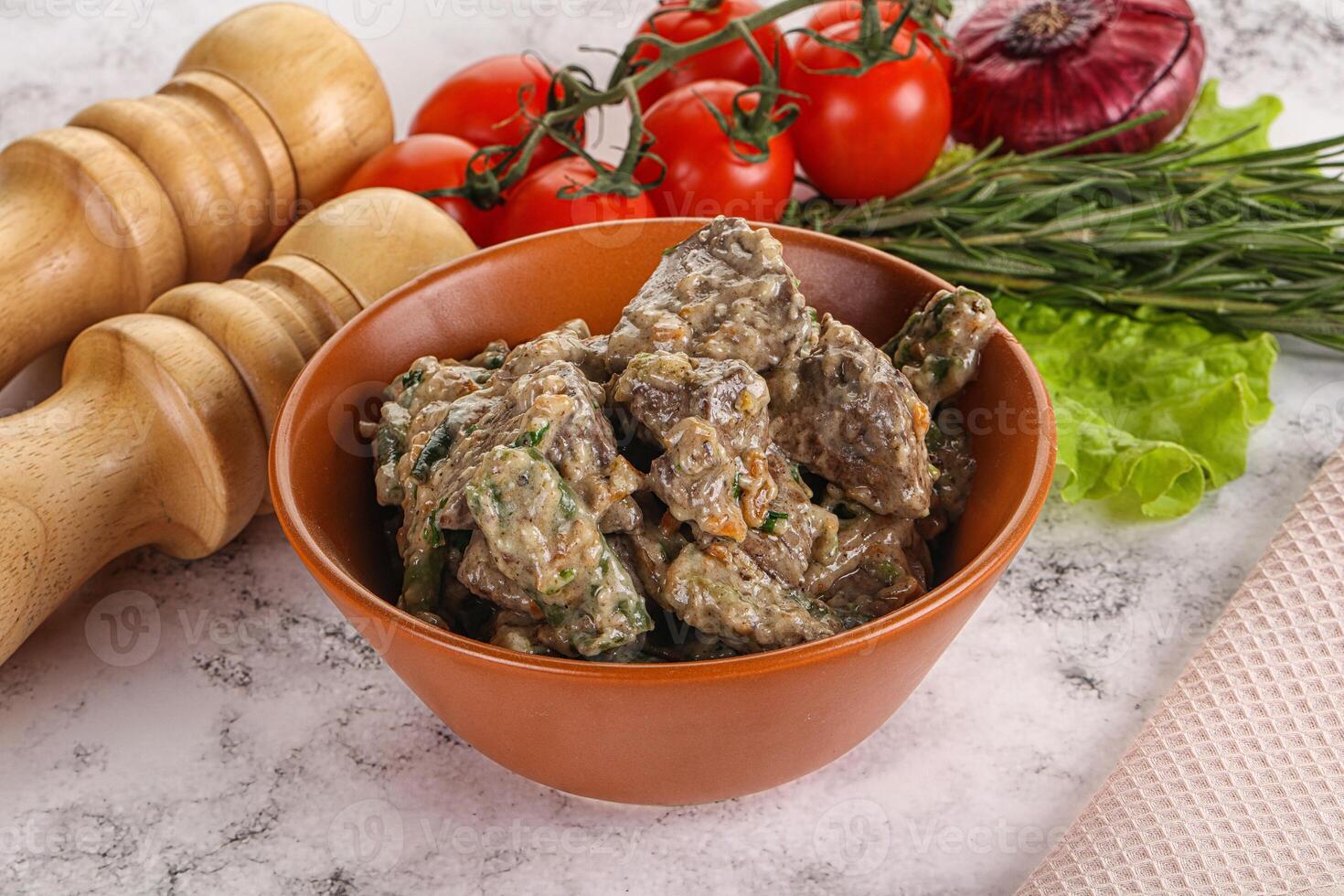 Fried turkey liver with herbs in cream sauce photo