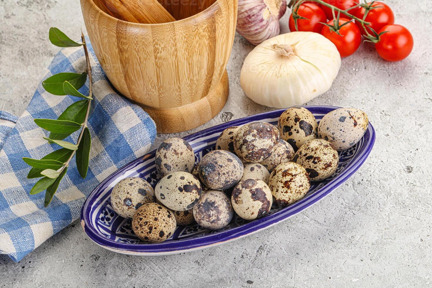 Raw quail eggs in the bowl photo