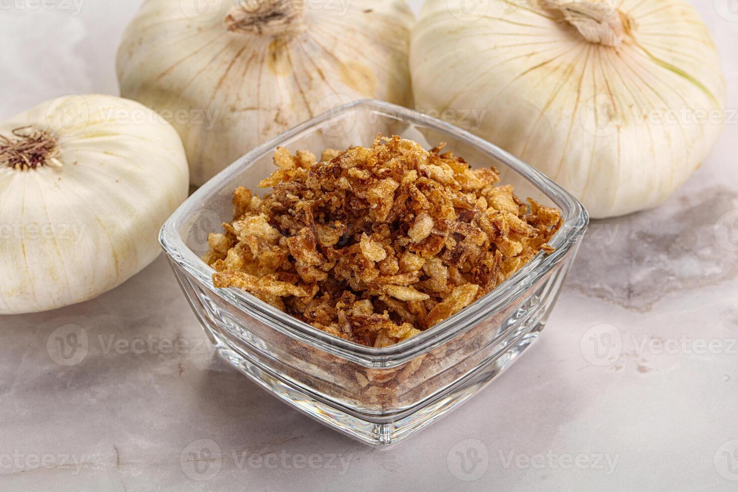 Dried roasted onion flakes for culinary photo