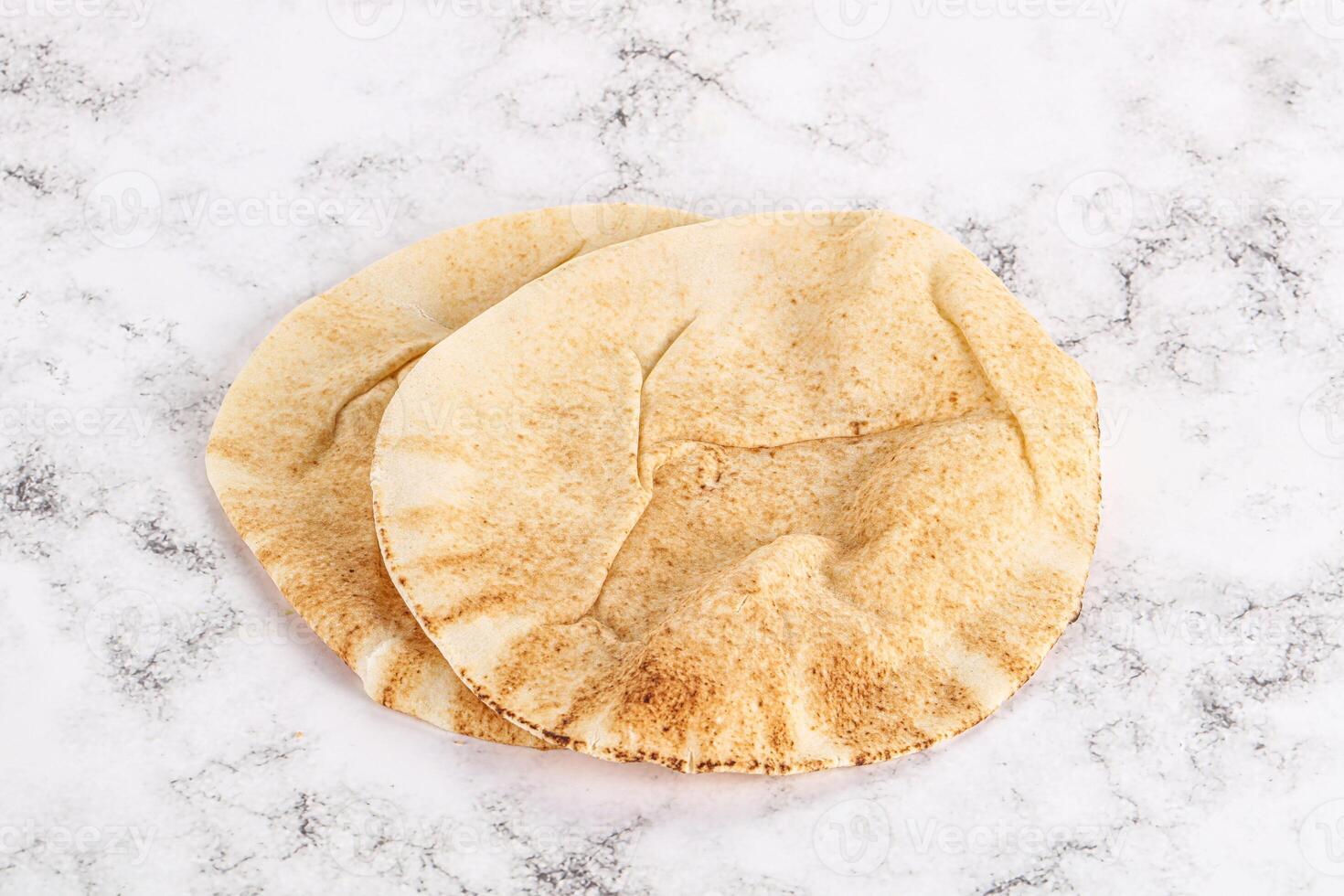 Traditional eastern round pita bread photo